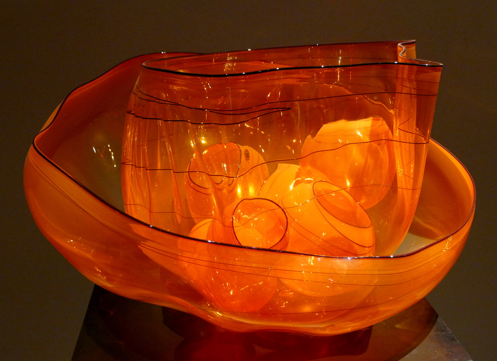 Chihuly - orange glass bowls within glass bowls