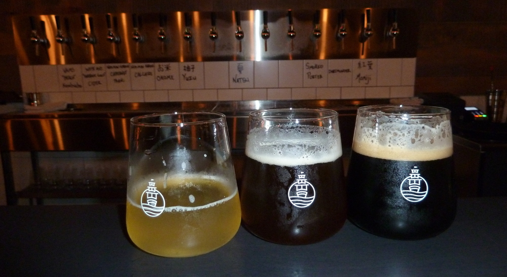 light, brown, and opaque beers with the taps behind