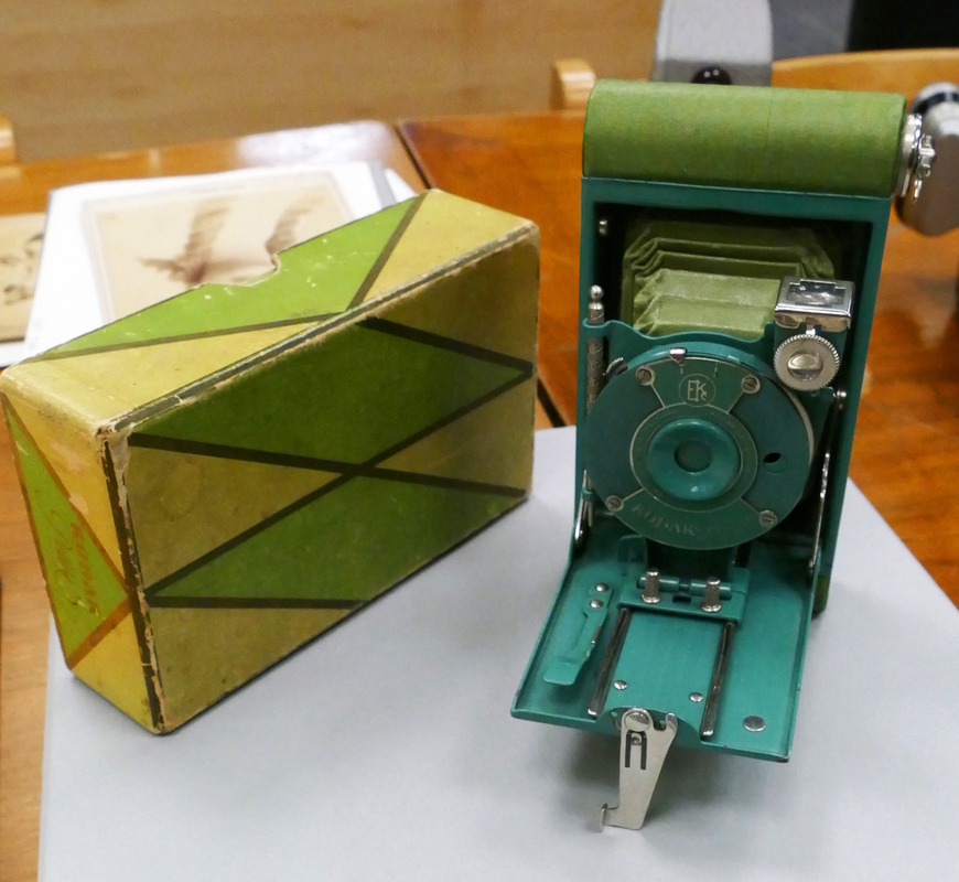 A vivid green fold-out camera