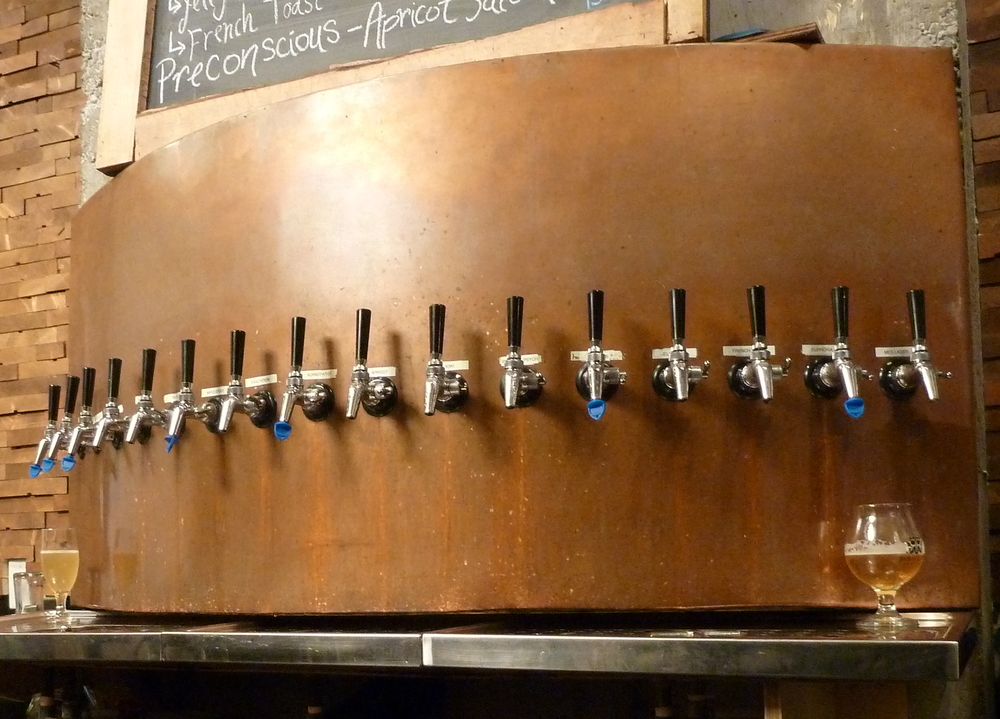 16 beer taps on an arc of copper plating
