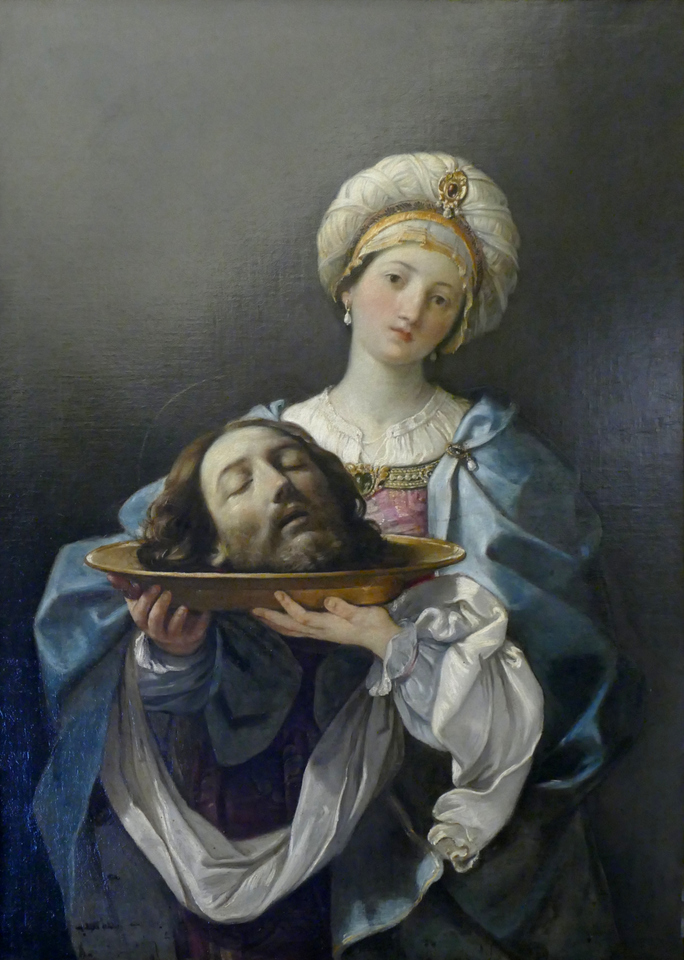 a rather unhappy girl holding a head on a platter
