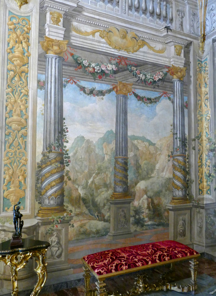 a wall with painted marble columns and an exterior view