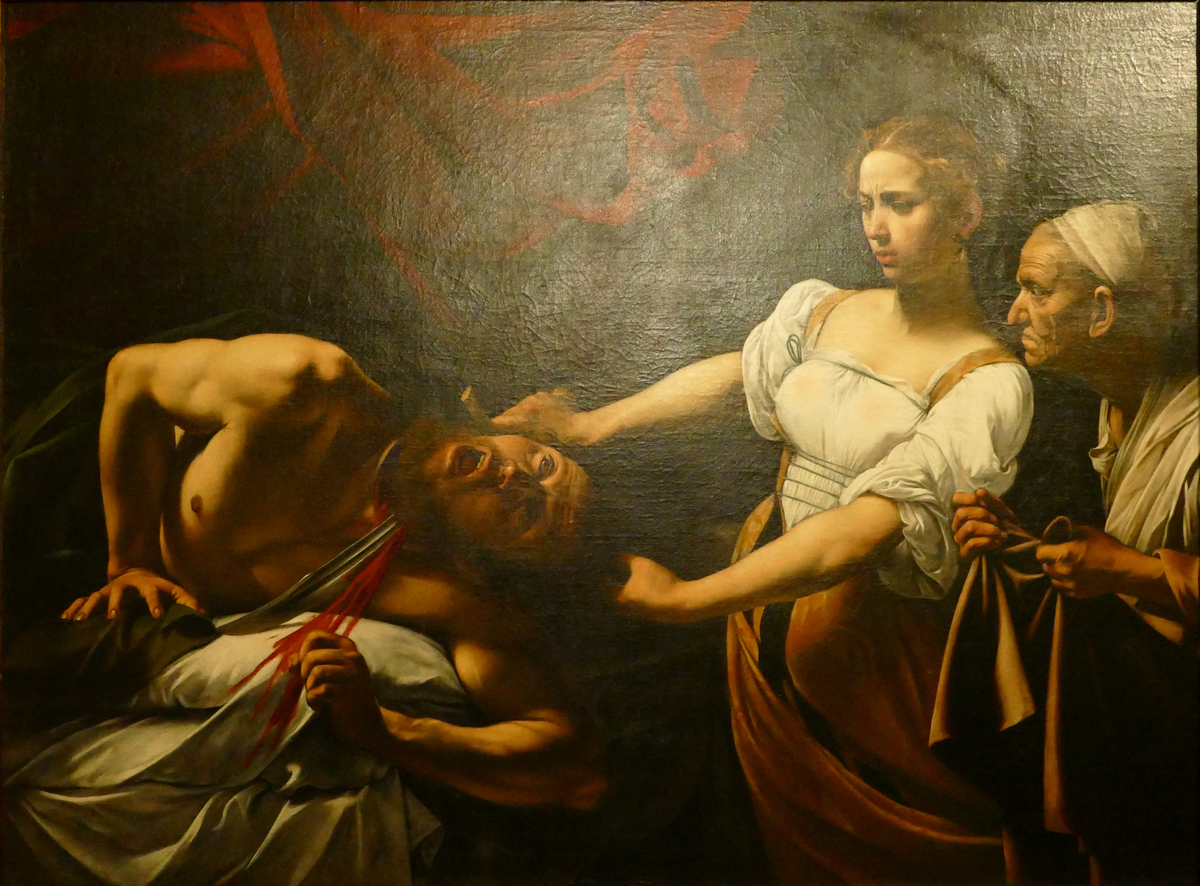 Judith is hacking off Holofernes' head (blood spurts) as her old servant woman looks on