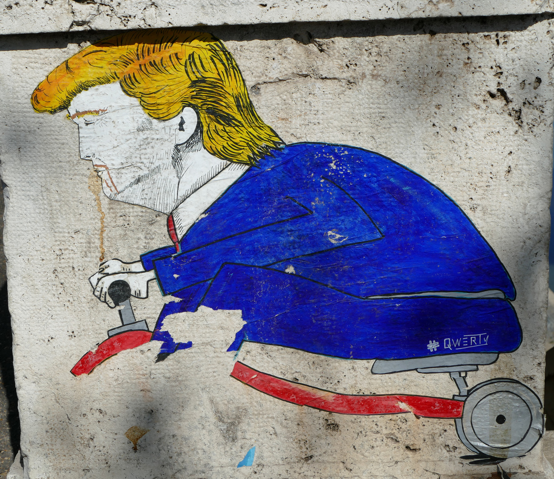 a colourful caricature of Donald Trump riding a tricycle