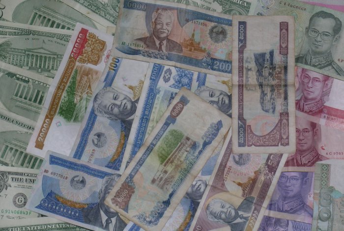 Lao Kip, Thai Baht, and U.S. Dollars.