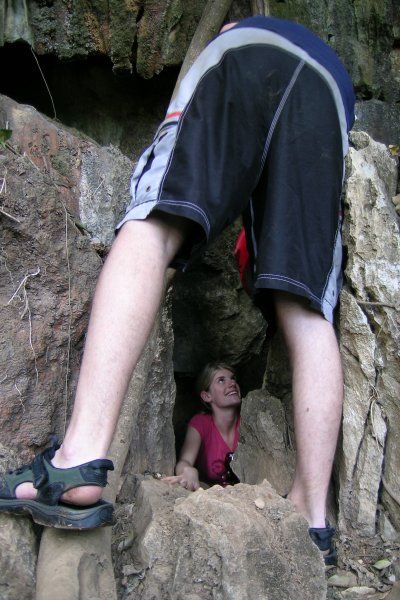 Chaz trying to help Lee scramble out of a cave in the Vang Vieng area.